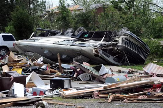 A recreational vehicle is overturned  and flattened in Rainsville, Ala., Thursday, April, 28, 2011. A least 32 people died when a tornado struck Dekalb County Wednesday.  (AP Photo/ Birmingham News, Mark Almond) **  MAGS OUT NO SALES **